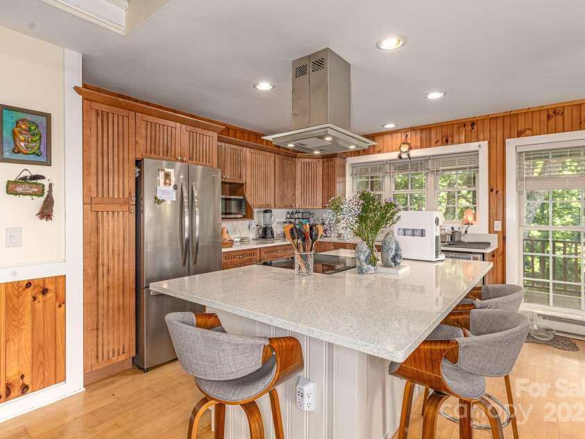 715 Sunset Mountain Road, Bakersville, NC 28705.  MLS# CAR4276207, YatesRealty ID 27672. Remodeled kitchen includes all new stainless appliances, new vent hood, updated fixtures.