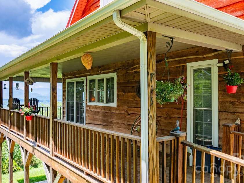 715 Sunset Mountain Road, Bakersville, NC 28705.  MLS# CAR4276207, YatesRealty ID 27672. Side deck, walk from driveway to front entrance.