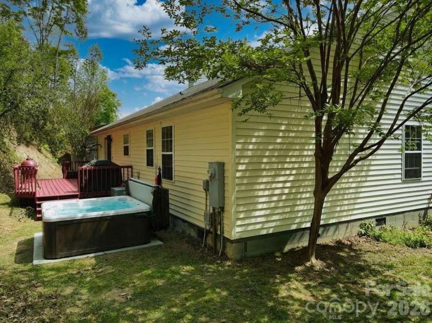 1798 New Stock Road, Weaverville, NC 28787.  MLS# CAR4379856, YatesRealty ID 27678. Hot tub on patio and freshly painnted back deck.