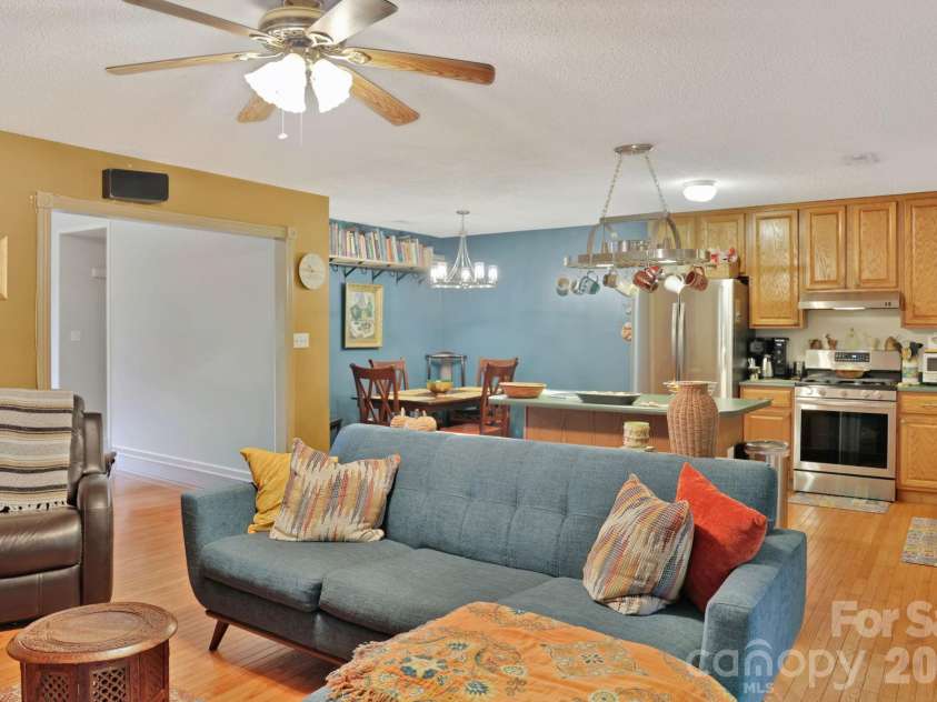 1798 New Stock Road, Weaverville, NC 28787.  MLS# CAR4379856, YatesRealty ID 27678. Open concept living space: kitchen flows into dining space and den.