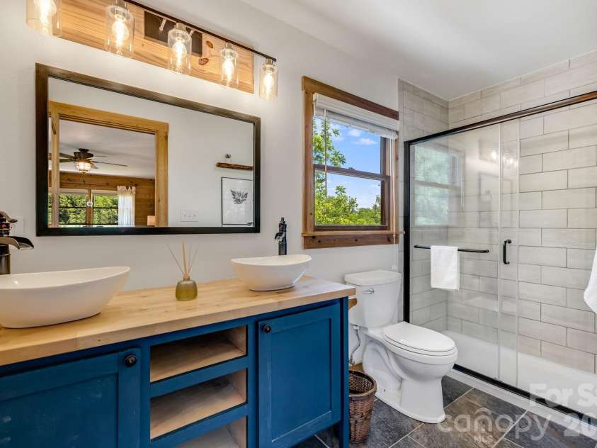 694 Boulder Road, Marshall, NC 28753.  MLS# CAR4384488, YatesRealty ID 27681. Beautifully tiled main Bathroom.