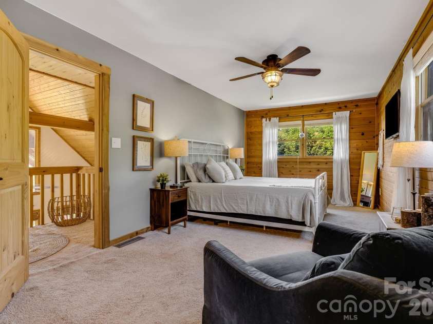694 Boulder Road, Marshall, NC 28753.  MLS# CAR4384488, YatesRealty ID 27681. Cozy Main bedroom with view of Great Room below.