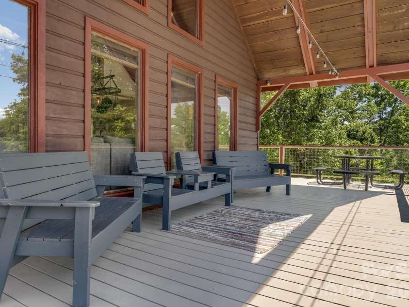 694 Boulder Road, Marshall, NC 28753.  MLS# CAR4384488, YatesRealty ID 27681. Enormous covered deck for entertaining and breathing the mountain air. 