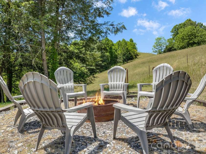 694 Boulder Road, Marshall, NC 28753.  MLS# CAR4384488, YatesRealty ID 27681. Fire pit for all your guests.