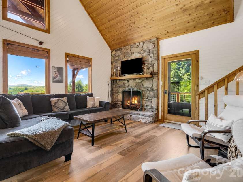 694 Boulder Road, Marshall, NC 28753.  MLS# CAR4384488, YatesRealty ID 27681. Great room w/ Wood burning Fireplace