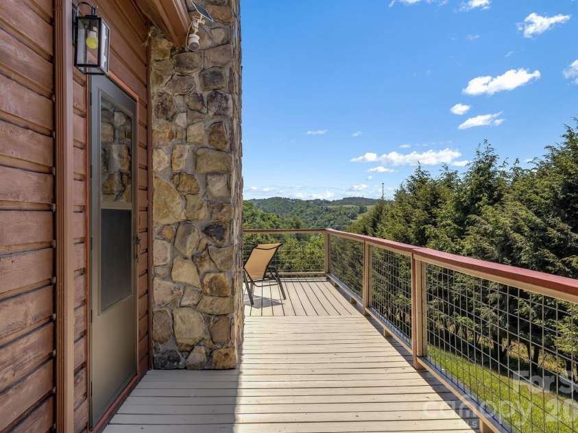 694 Boulder Road, Marshall, NC 28753.  MLS# CAR4384488, YatesRealty ID 27681. Side porch