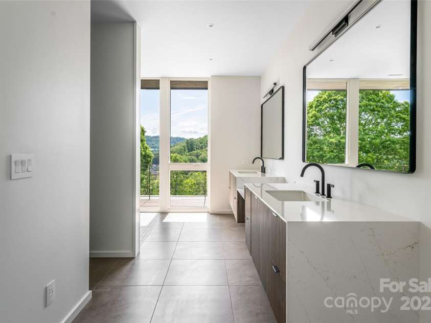 502 Wilma Dykeman Trail, Asheville, NC 28804.  MLS# CAR4271749, YatesRealty ID 27683. Ensuite Full Bath with Floating Quartz-Topped Double Vanity