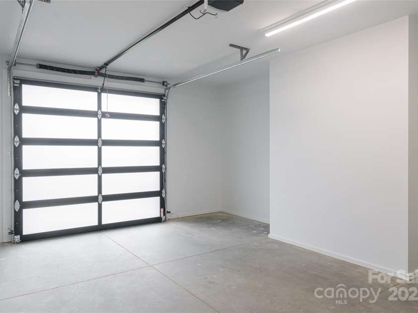 502 Wilma Dykeman Trail, Asheville, NC 28804.  MLS# CAR4271749, YatesRealty ID 27683. Oversized One-Car Garage with Extra Storage