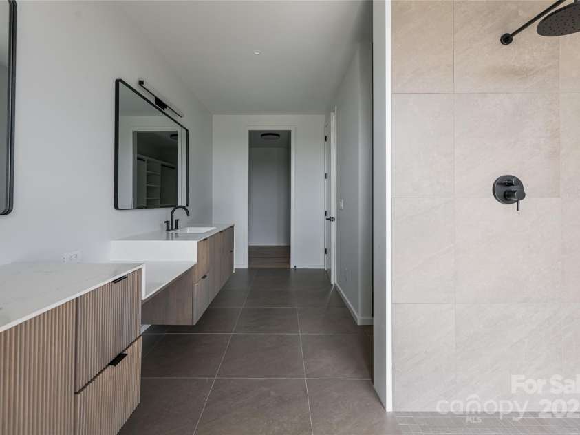 502 Wilma Dykeman Trail, Asheville, NC 28804.  MLS# CAR4271749, YatesRealty ID 27683. Walk-In Closet Through Ensuite Bath