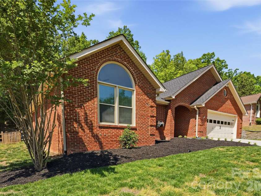 772 Monticello Drive, Fort Mill, SC 29708.  MLS# CAR4371119, YatesRealty ID 27685. Front Exterior with Sloped Driveway and 2-Car Garage
