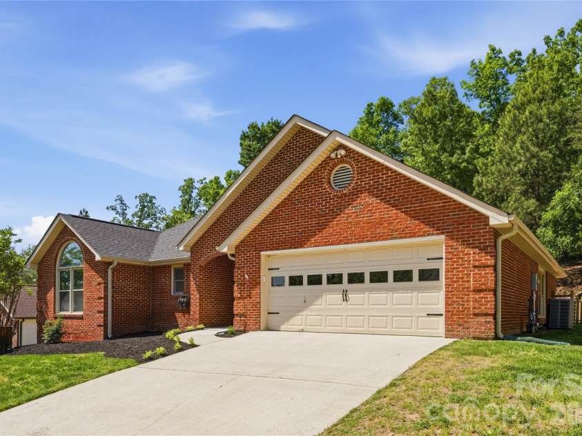 772 Monticello Drive, Fort Mill, SC 29708.  MLS# CAR4371119, YatesRealty ID 27685. Front Exterior with Sloped Driveway and 2-Car Garage