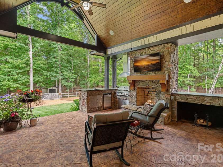 6808 Live Oaks Lane, Waxhaw, NC 28173.  MLS# CAR4388125, YatesRealty ID 27688. Covered porch with built-in grill 