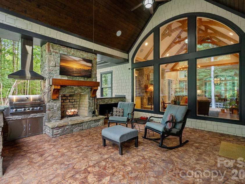 6808 Live Oaks Lane, Waxhaw, NC 28173.  MLS# CAR4388125, YatesRealty ID 27688. Covered porch w/wood burning fireplace 