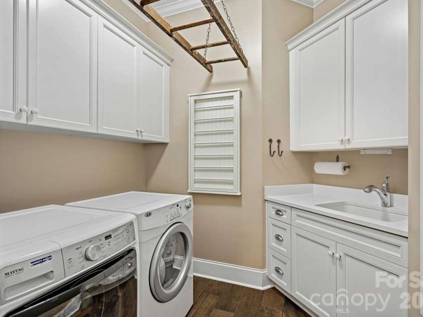 6808 Live Oaks Lane, Waxhaw, NC 28173.  MLS# CAR4388125, YatesRealty ID 27688. Laundry  with antique ladder drying rack 