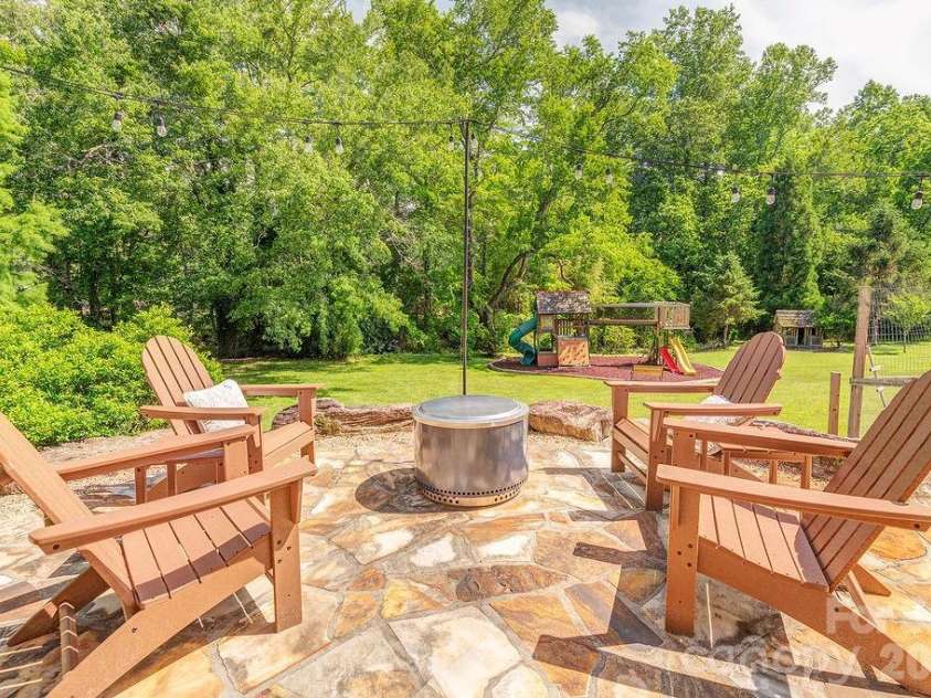 201 Skytop Farm Lane, Hendersonville, NC 28791.  MLS# CAR4387664, YatesRealty ID 27689. Spacious patio has room for relaxing under the stars