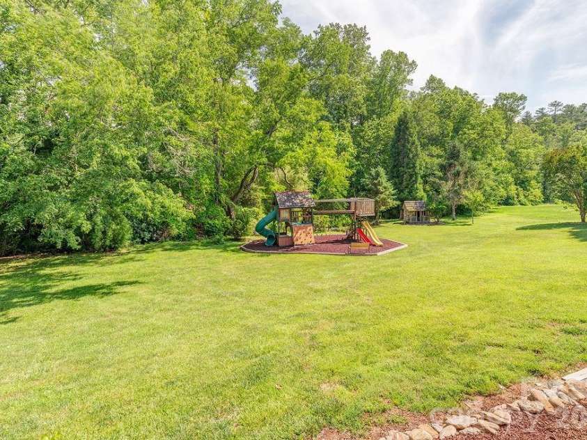 201 Skytop Farm Lane, Hendersonville, NC 28791.  MLS# CAR4387664, YatesRealty ID 27689. Spacious yard with plenty of level space to play