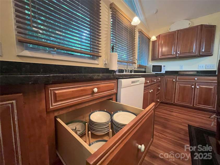 126 Sleeping Bear Lane, Lake Lure, NC 28746.  MLS# CAR4276702, YatesRealty ID 27694. Abundant and efficient storage in the kitchen cabinetry.