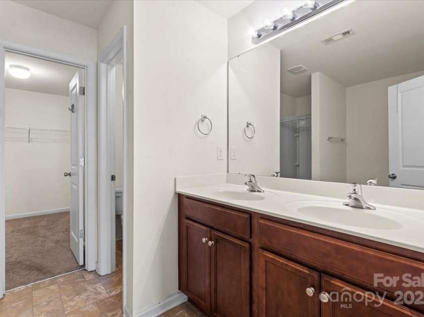 2515 Walnut Forest Drive, Charlotte, NC 28216.  MLS# CAR4260592, YatesRealty ID 27696. Primary Dual Vanity Sink