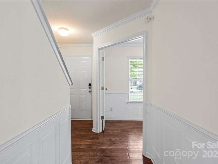 2515 Walnut Forest Drive, Charlotte, NC 28216.  MLS# CAR4260592, YatesRealty ID 27696. Wainscoting & crownmolding throughout office, hallway entry and dining area