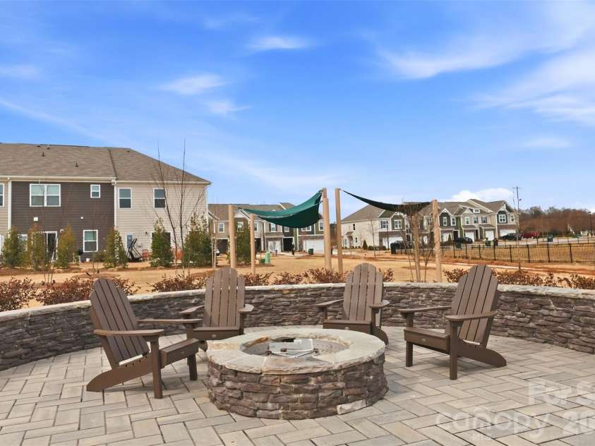 5231 Maynard Hill Drive, Monroe, NC 28110.  MLS# CAR4342492, YatesRealty ID 27696. Community fire pit gathering area