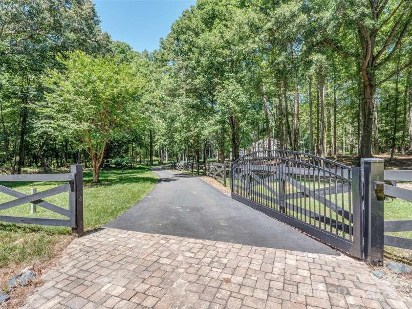 202 Walden Lane, Weddington, NC 28104.  MLS# CAR4274897, YatesRealty ID 27698. Gated entry to property