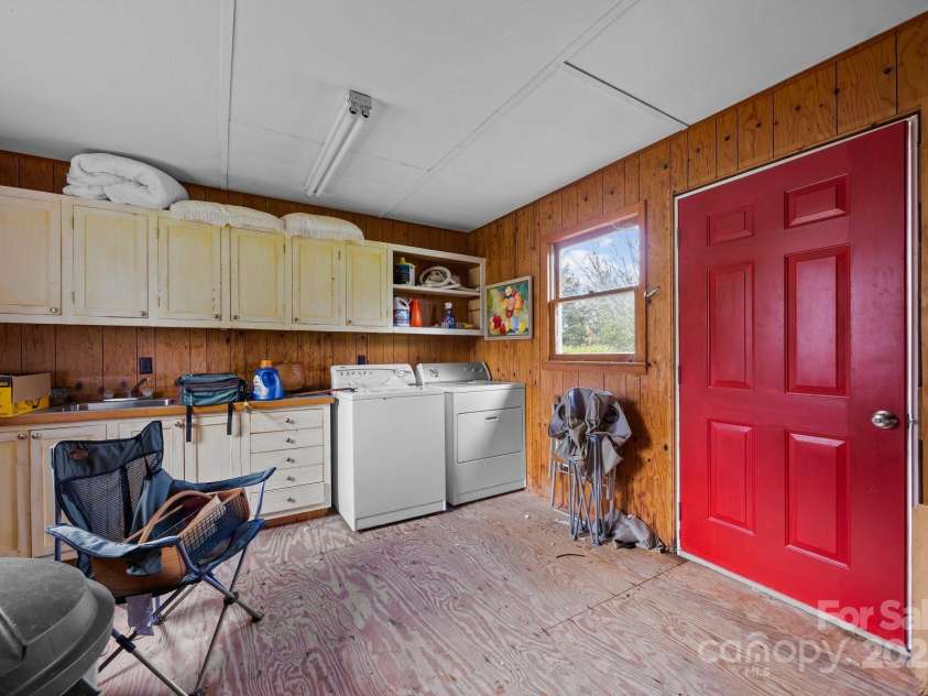 457 Overlook Drive, Spruce Pine, NC 287777.  MLS# CAR4245586, YatesRealty ID 2770. Interior of outbuilding houses laundry