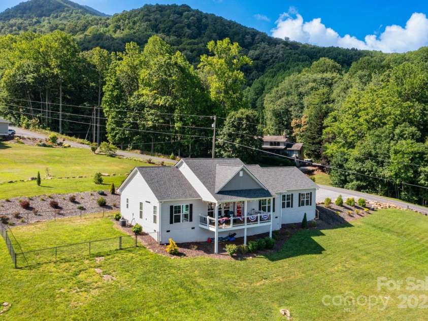 605 Red Bank Road, Waynesville, NC 28786.  MLS# CAR4277053, YatesRealty ID 27707. Back and side view showing fenced yard