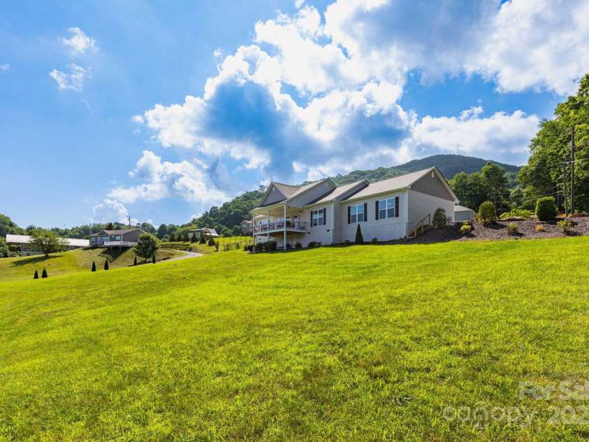 605 Red Bank Road, Waynesville, NC 28786.  MLS# CAR4277053, YatesRealty ID 27707. Your large lot and rear view of home