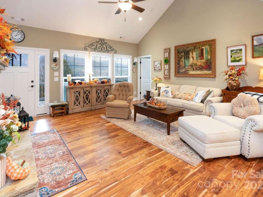 605 Red Bank Road, Waynesville, NC 28786.  MLS# CAR4313671, YatesRealty ID 27707. Beautiful acacia wood flooring throughout the home.  Enjoy the mountain views from the living area.