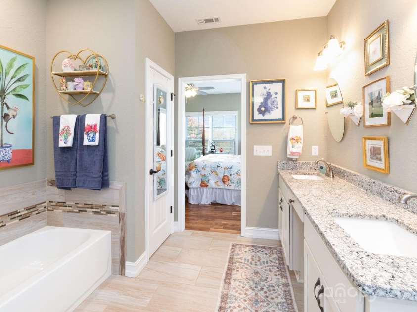 605 Red Bank Road, Waynesville, NC 28786.  MLS# CAR4313671, YatesRealty ID 27707. Enjoy getting ready each day in this spacious en suite bath with dual sinks, and soaking tub