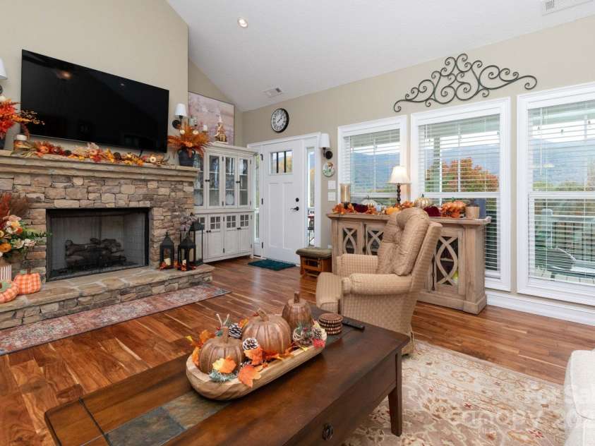 605 Red Bank Road, Waynesville, NC 28786.  MLS# CAR4313671, YatesRealty ID 27707. Enjoy the fireplace and views from the couch.