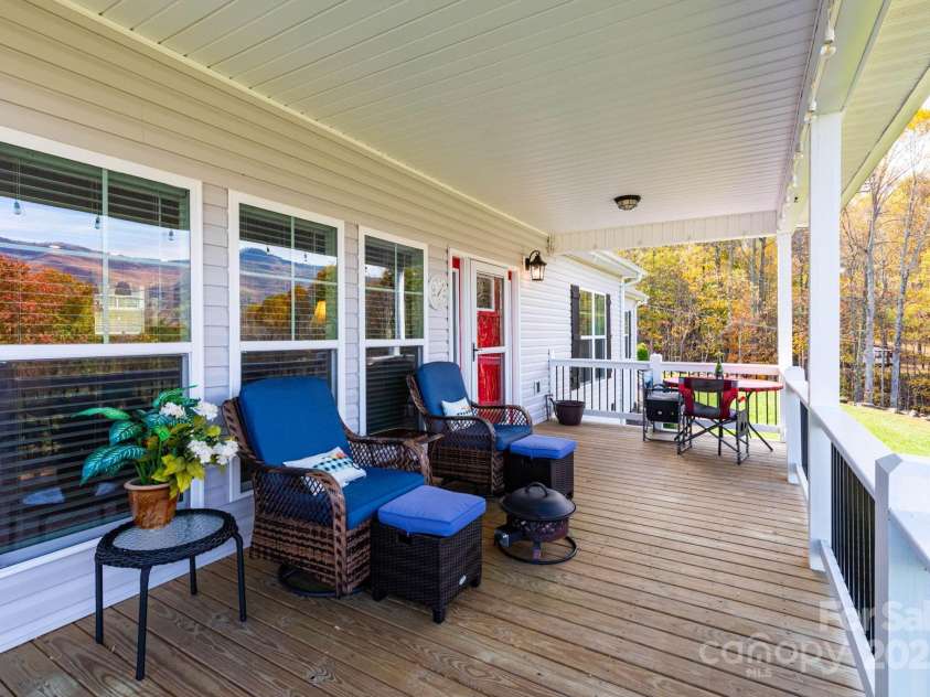 605 Red Bank Road, Waynesville, NC 28786.  MLS# CAR4313671, YatesRealty ID 27707. Fully covered back porch with room for dining and lounging