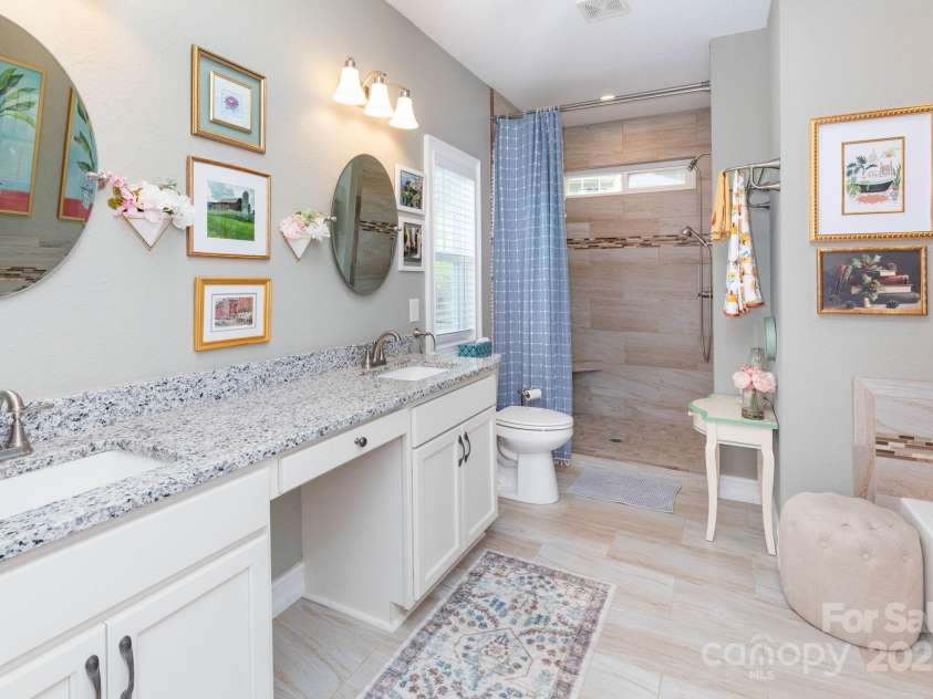 605 Red Bank Road, Waynesville, NC 28786.  MLS# CAR4313671, YatesRealty ID 27707. Great natural light in the en suite bath with large format tile flooring