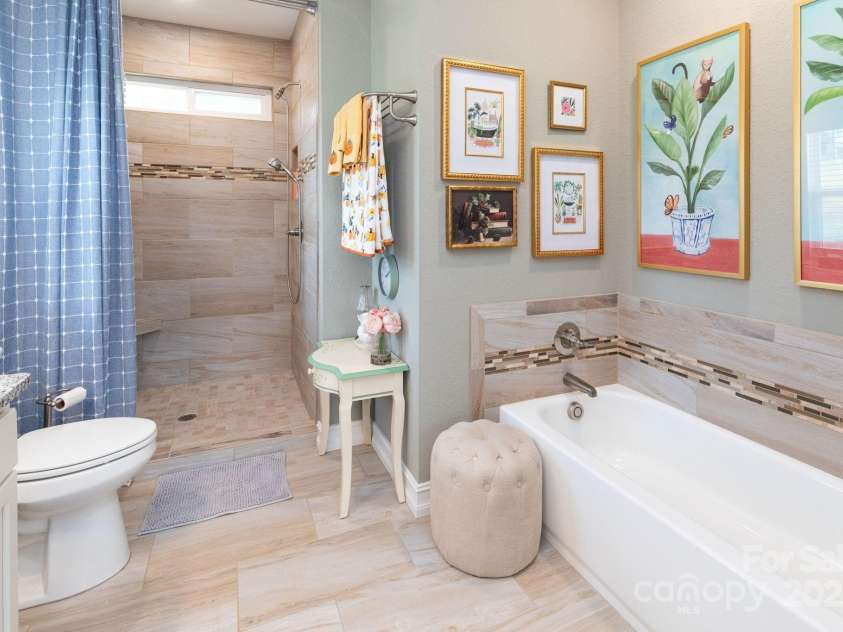 605 Red Bank Road, Waynesville, NC 28786.  MLS# CAR4313671, YatesRealty ID 27707. The en suite bath also features a large walk in fully tiled shower.