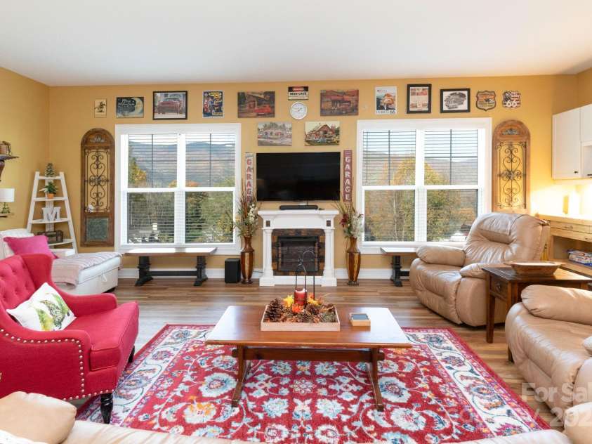 605 Red Bank Road, Waynesville, NC 28786.  MLS# CAR4313671, YatesRealty ID 27707. The perfect spot to gather is the two car garage which has been fully drywalled and painted with luxury vinyl plank flooring