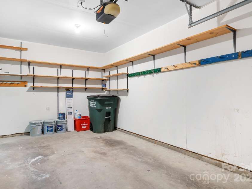 9911 Birch Knoll Court, Charlotte, NC 28213.  MLS# CAR4278633, YatesRealty ID 27712. One Car Garage with Storage Shelves