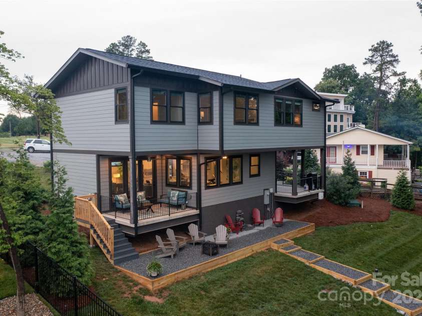113 Angler Place, Mooresville, NC 28117.  MLS# CAR4217106, YatesRealty ID 2772. Aerial view of back side of the home facing Lake Norman.