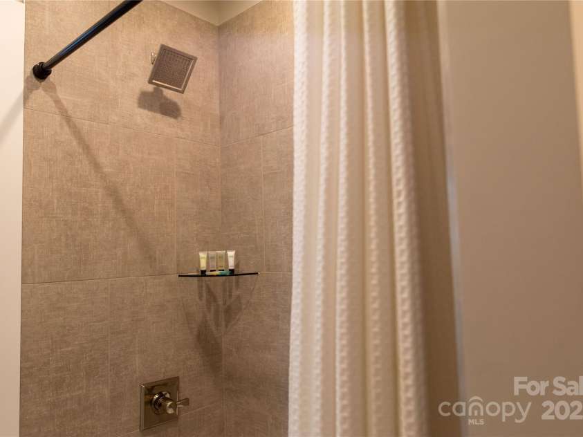 113 Angler Place, Mooresville, NC 28117.  MLS# CAR4217106, YatesRealty ID 2772. Beautiful textured tile and custom fixtures.