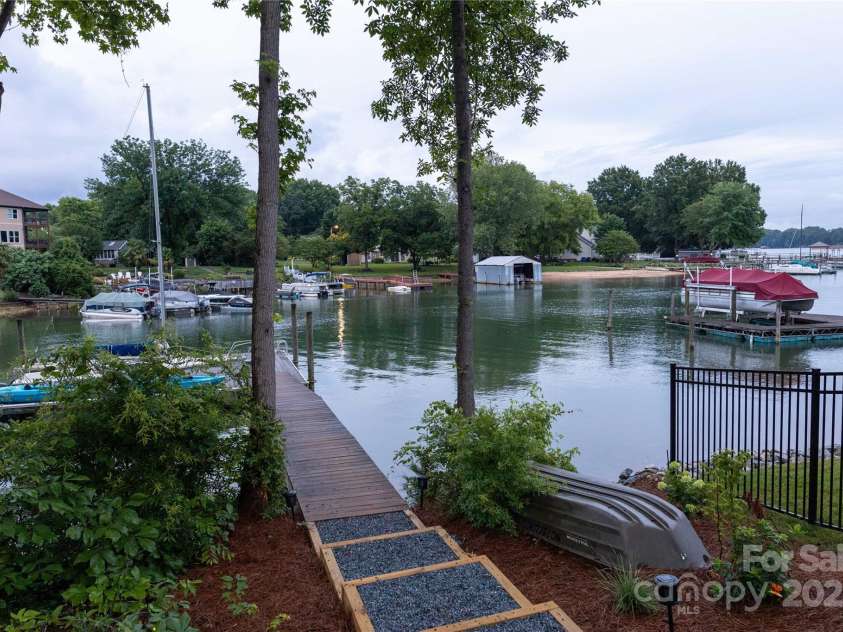 113 Angler Place, Mooresville, NC 28117.  MLS# CAR4217106, YatesRealty ID 2772. Calm cove close the the Stutts marina that sits around the corner on the main channel.
