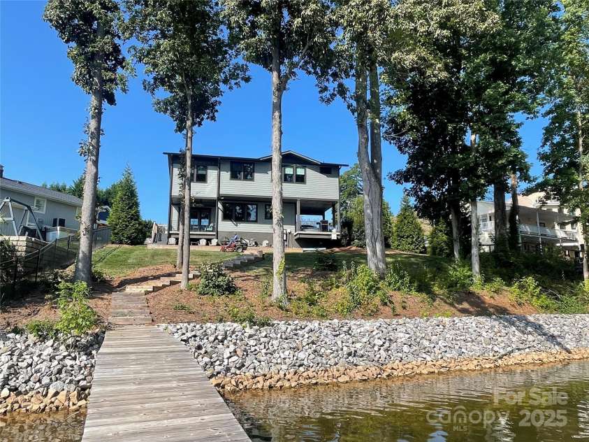 113 Angler Place, Mooresville, NC 28117.  MLS# CAR4217106, YatesRealty ID 2772. Cleared rip raped shoreline with a dock.