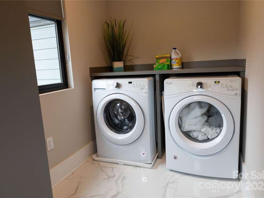 113 Angler Place, Mooresville, NC 28117.  MLS# CAR4217106, YatesRealty ID 2772. Elegant laundry room with custom cabinet for linnens.