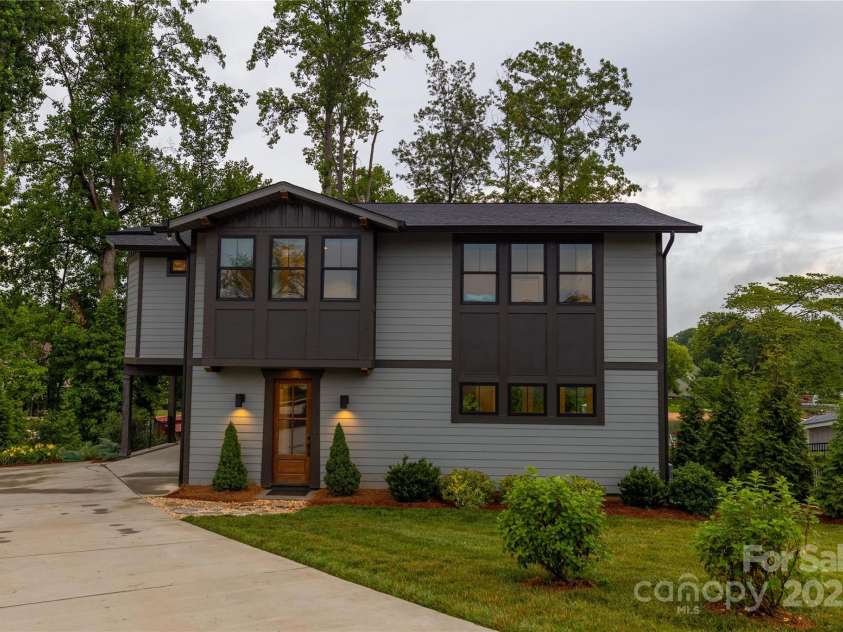 113 Angler Place, Mooresville, NC 28117.  MLS# CAR4217106, YatesRealty ID 2772. Front view with concrete driveway to pull under the porteco.