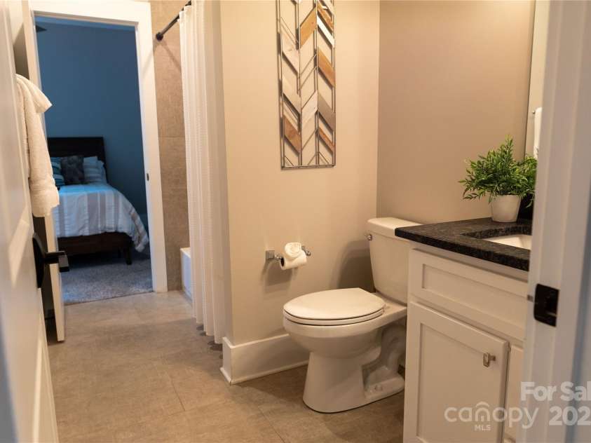 113 Angler Place, Mooresville, NC 28117.  MLS# CAR4217106, YatesRealty ID 2772. Jack and Jill bathroom with custom tile on the floor and the shower.