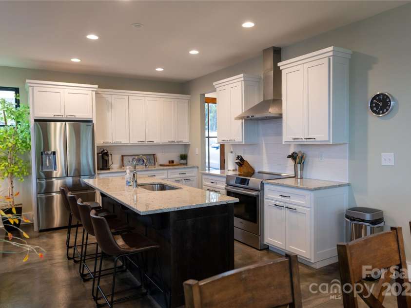 113 Angler Place, Mooresville, NC 28117.  MLS# CAR4217106, YatesRealty ID 2772. Kitchen of your dreams with recess lighting and custom granite counters.