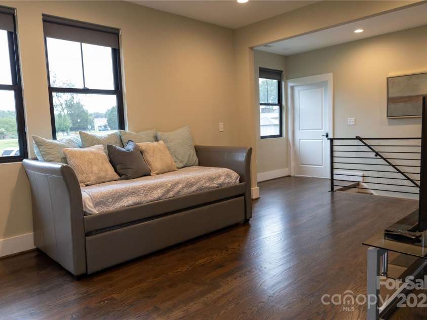 113 Angler Place, Mooresville, NC 28117.  MLS# CAR4217106, YatesRealty ID 2772. Large den is located beside the stairs and laundry room.