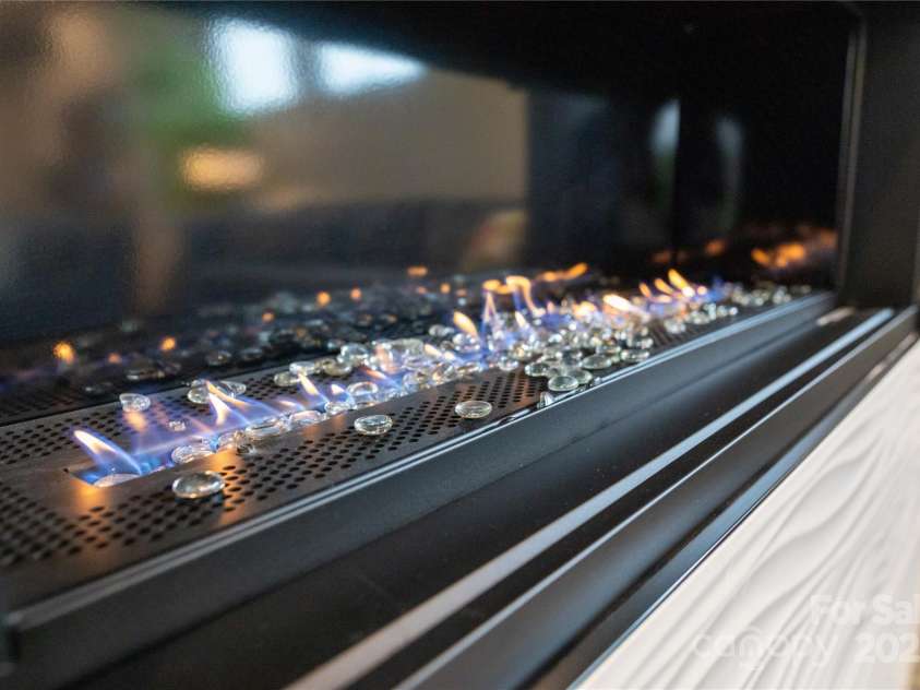 113 Angler Place, Mooresville, NC 28117.  MLS# CAR4217106, YatesRealty ID 2772. Linear gas fireplace.