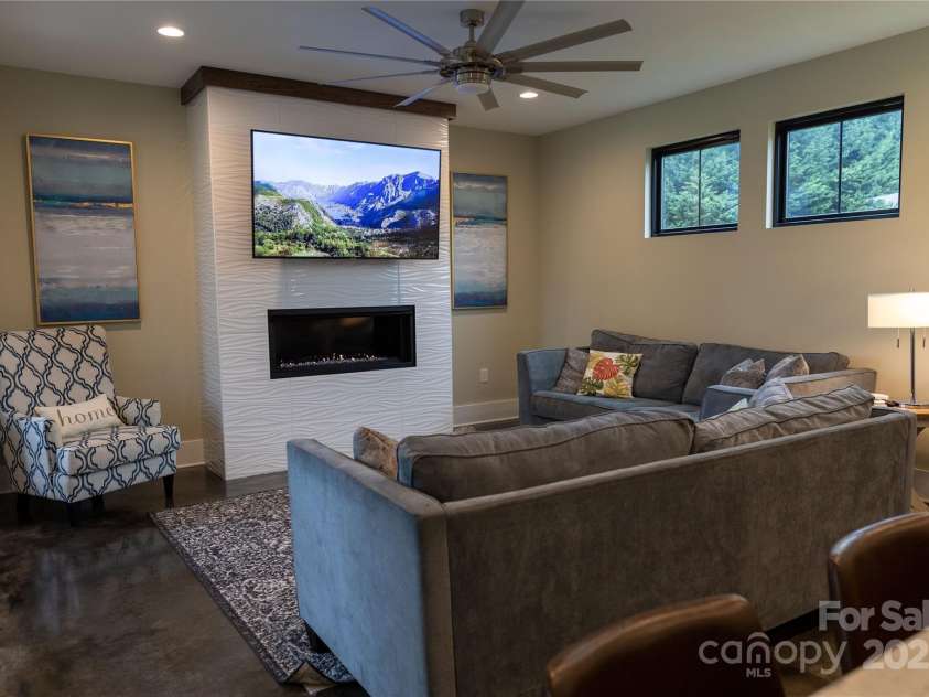 113 Angler Place, Mooresville, NC 28117.  MLS# CAR4217106, YatesRealty ID 2772. Living room on the main floor with stained concrete floors.