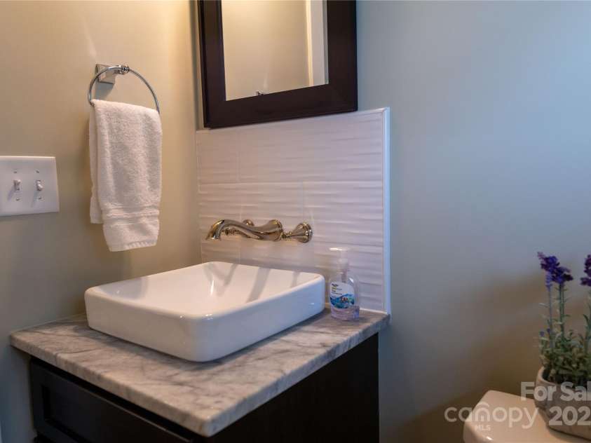 113 Angler Place, Mooresville, NC 28117.  MLS# CAR4217106, YatesRealty ID 2772. Modern floating cabinet with square sink and wall fixtures.