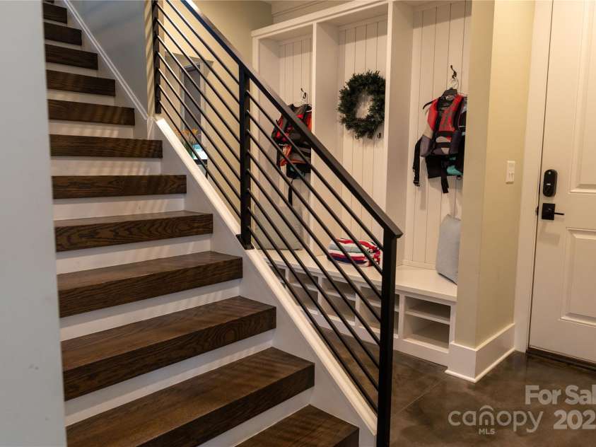 113 Angler Place, Mooresville, NC 28117.  MLS# CAR4217106, YatesRealty ID 2772. Modern staircase to the second floor.