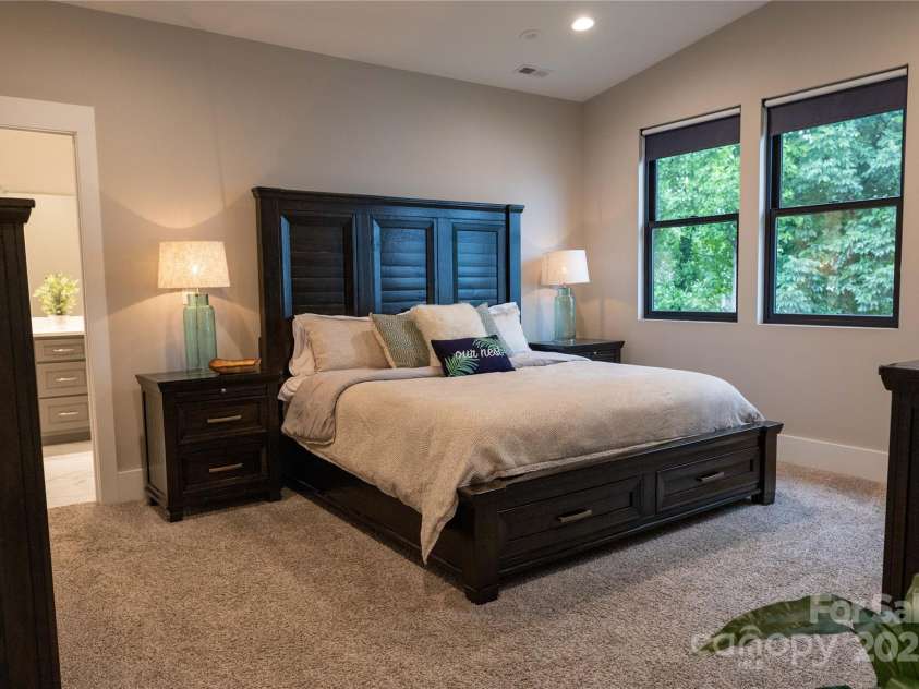 113 Angler Place, Mooresville, NC 28117.  MLS# CAR4217106, YatesRealty ID 2772. Primary bedroom with slightly elevated ceilings and views of the sunrise.